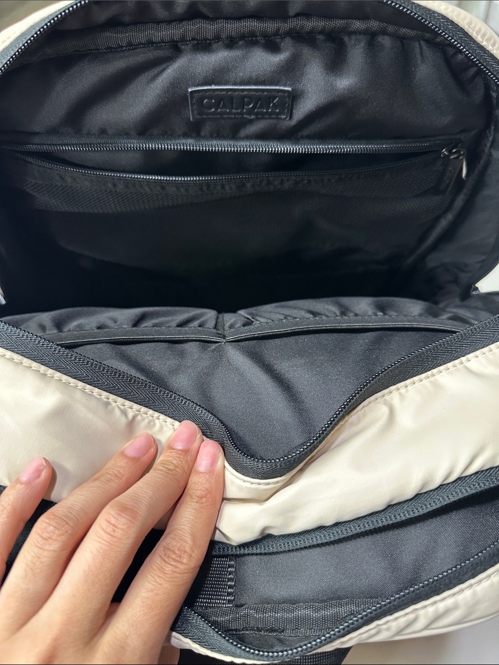 Calpak Light Beige Padded Backpack with Black Accents. Travel Backpack - Picture 8 of 11